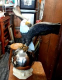 28-in tall composite eagle on chrome ball pedestal. Wingspan is 32 in