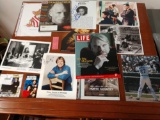 Collection of autographed pictures and magazines