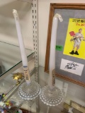 Glass candlestick holders with candles