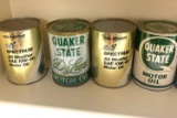 Eight vintage cans of motor oil