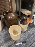 Two large jugs and one small crock