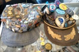 Two hats loaded with pins