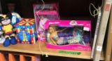 Contents on shelf books barbies jack in box 3- dolls
