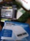 Assorted lot including digital scale, games, and tablet holder