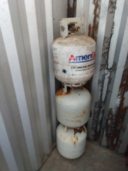 Three propane cylinders