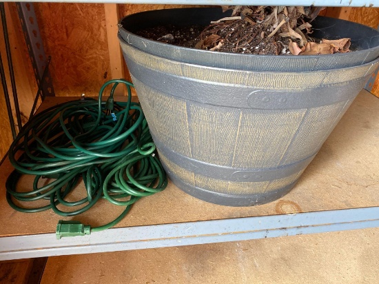 Three extension cords and a pair of plastic planters shed
