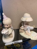 Two precious moments figurines
