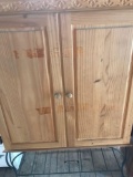 Wooden cabinet with metal bottom 38? across 51? tall