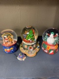 Three Christmas snow globes