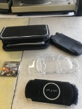 Sony PSP handheld game with game covers and case works
