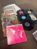 Record sleeves plus a few loose records