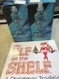 Christmas the elf on the shelf book and 2- nutcracker candle holders