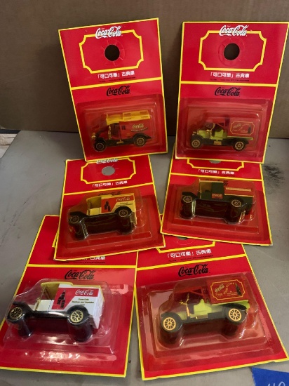Six collectible Coca-Cola trucks