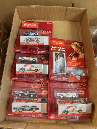 Five Coca-Cola collectible cars new old stock