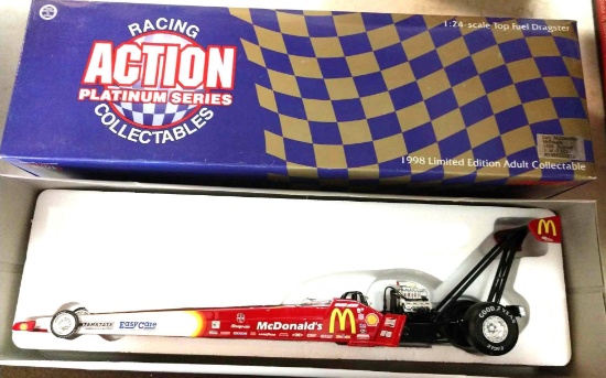 Racing action 124th scale core y McLennan top field dragster