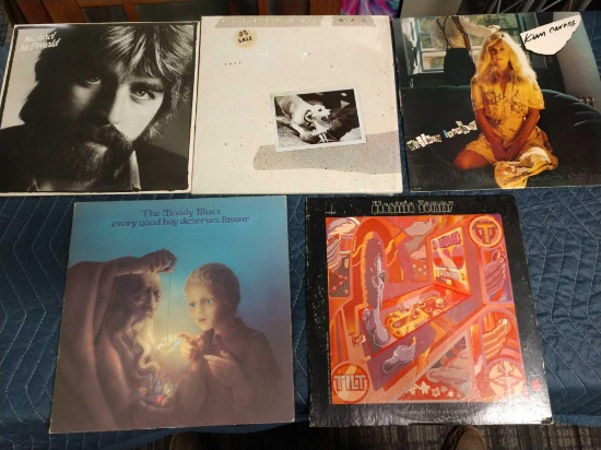 Five record albums including The Moody blues, electric Tommy, Kim carnes, Fleetwood Mac, and Michael