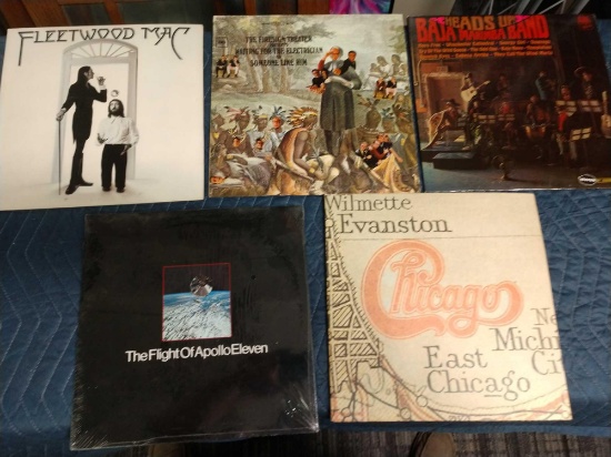 Five record albums including the flight of Apollo 11, Fleetwood Mac, the fire sign theater, Baja