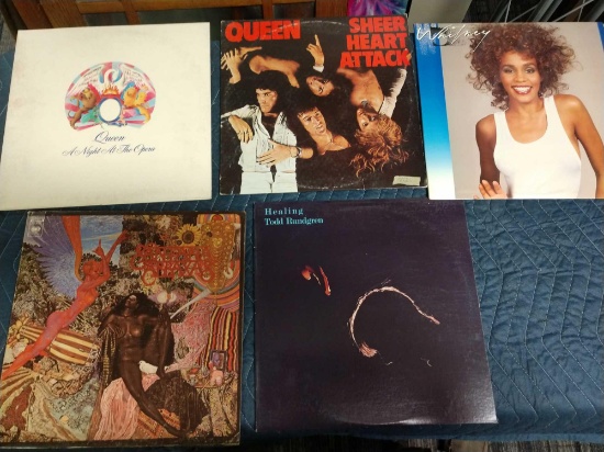 Five record albums including Todd rundgren, Santana, Queen, and Whitney Houston