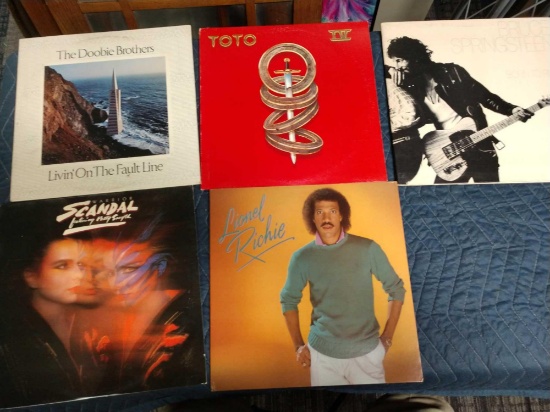 Five record albums including Bruce Springsteen, Toto, Lionel Richie, The Doobie Brothers, and