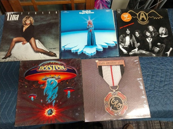 Five record albums including ELO, Boston, Tina Turner, Bob seger, and Aerosmith