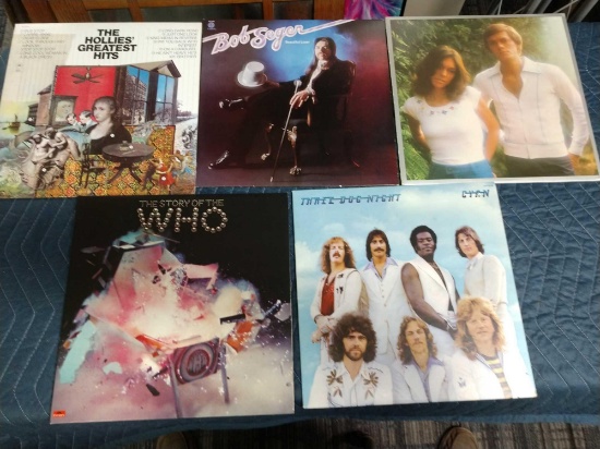Five record albums including The who, the hollies, the Carpenters, Three dog night, and Bob seger