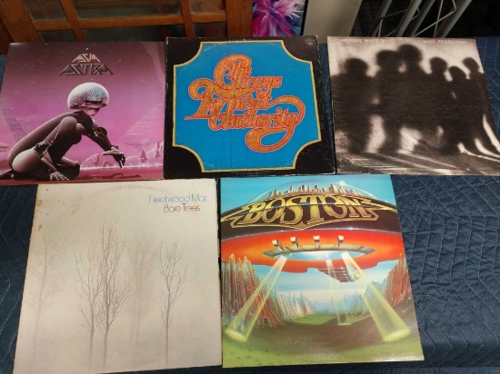 Five record albums including Fleetwood Mac, average white band, Boston, Asia, and Chicago