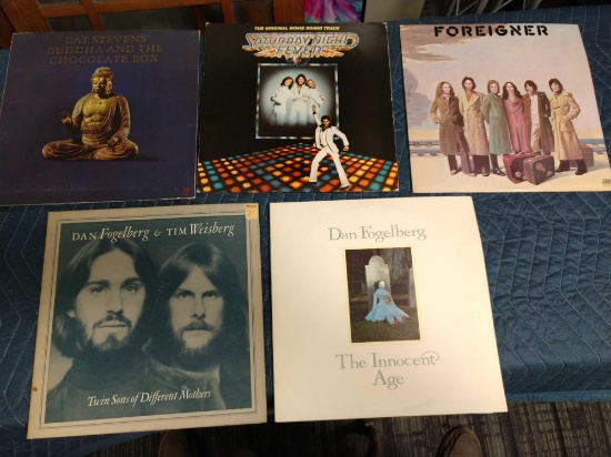 Five record albums including cat Stevens, Dan fogelberg, foreign er, and Saturday night fever