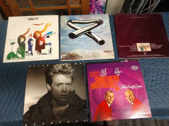 Five record albums including ambrosia, ABBA,, tubular bells, Bryan Adams, and the smothers Brothers