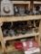 three shelves of miscellaneous transmission parts
