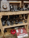 three shelves of miscellaneous transmission parts