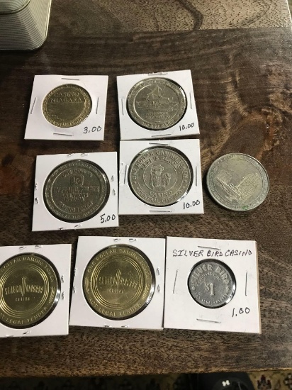 8- assorted Casino tokens