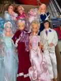 box lot Barbie and ken dolls and pile of clothes