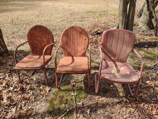 three vintage lawn chairs