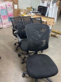 five black computer chairs