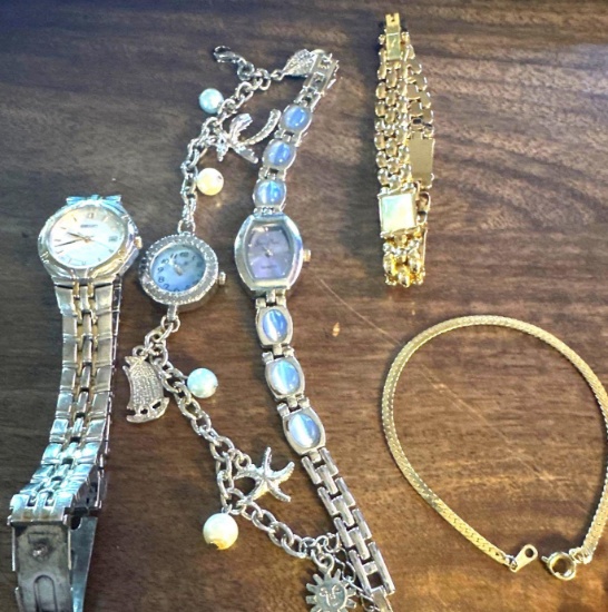 lot of three watches, and two bracelets