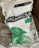 Pallet of lawn care products organic grow fertilizer bring help to load