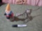 bobbing gnome and metal dinosaur