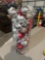 22 inch decorative vase full of Christmas ornaments