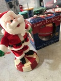 2- battery operated Santas