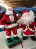 2- battery operated Santas