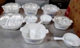nine pieces of Corning dishware