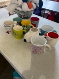 9 snoopy mugs