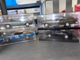 A lot of four built kits 1/24 in display cases