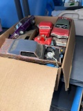 two boxes of plastic metal kits missing parts