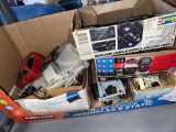three boxes, plastic metal kits missing parts