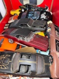 two boxes, model cars missing parts