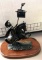Signed metal figurine