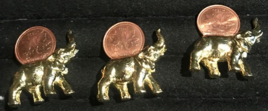 3- Canadian Pennies on gold elephants