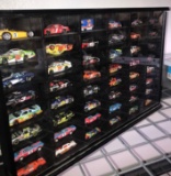 48- Nascar stock cars in a hanging display case