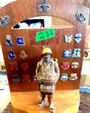 large military statue with military pins